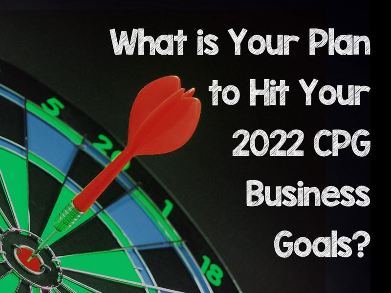 Dart hitting centre portion of dart board to illustrate hitting CPG business goals